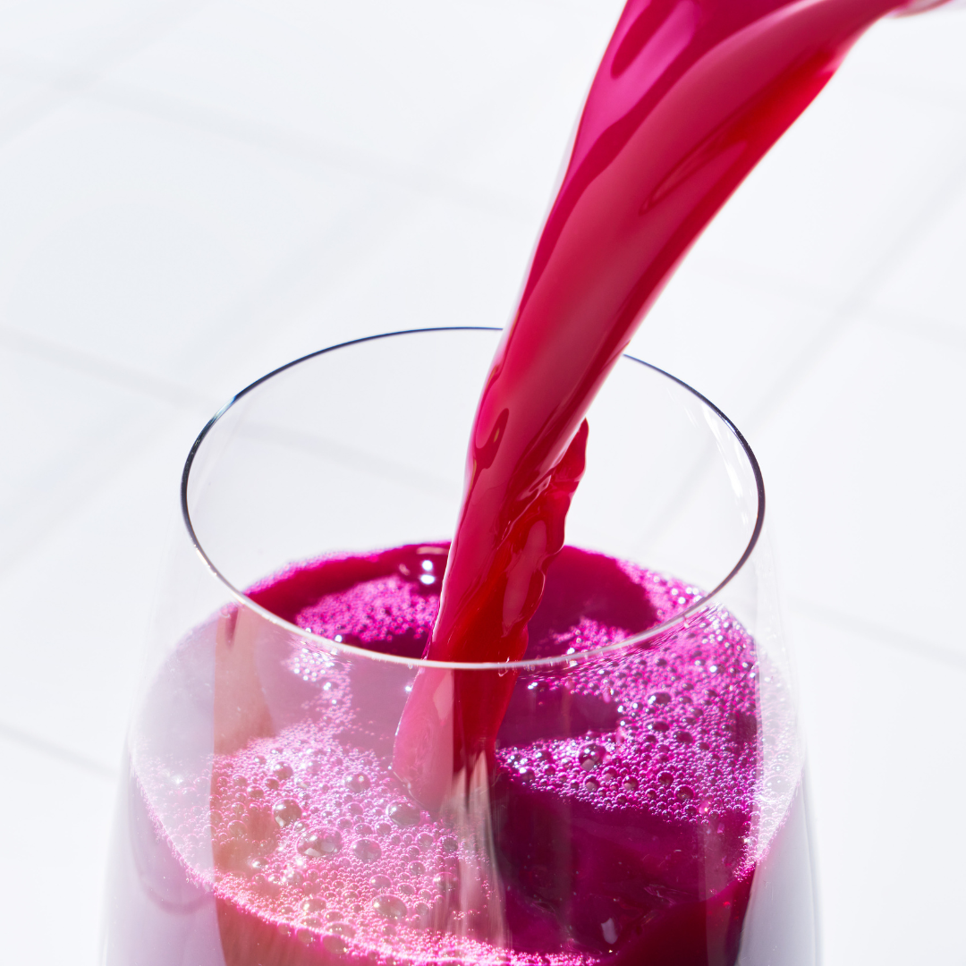 Waved Tech-Optimised Cold-Pressed Juice Sweet Beet Pouring Into A Glass